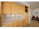 Small kitchen with light wood cabinets, a sink, and ample counter space at 17022 E Player Ct, Fountain Hills, AZ 85268