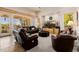 Relaxing living room with leather furniture and mountain views at 17022 E Player Ct, Fountain Hills, AZ 85268