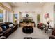 Living room with dark leather furniture and a large TV at 17022 E Player Ct, Fountain Hills, AZ 85268