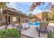 Community pool with lounge chairs and covered seating at 1718 W Colter St # 193, Phoenix, AZ 85015