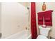 This bathroom features a bathtub and shower, plus red accents at 17844 E Pacana Ct, Gold Canyon, AZ 85118