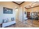 Cozy bedroom featuring neutral tones, tile flooring, and ample natural light from a large sliding-door closet at 17844 E Pacana Ct, Gold Canyon, AZ 85118