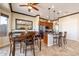 Dining room featuring stylish seating and views into the kitchen and backyard at 17844 E Pacana Ct, Gold Canyon, AZ 85118