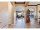 Grand foyer featuring tile floors, arched doorways, and views into the living and dining spaces at 17844 E Pacana Ct, Gold Canyon, AZ 85118