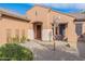 Attractive front facade with stucco exterior, desert landscaping, and inviting entrance at 17844 E Pacana Ct, Gold Canyon, AZ 85118