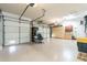 Well-organized garage with storage cabinets, workbench area, and ample space for multiple vehicles at 17844 E Pacana Ct, Gold Canyon, AZ 85118