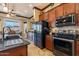 A spacious kitchen with stainless steel appliances, granite countertops, and tile flooring at 17844 E Pacana Ct, Gold Canyon, AZ 85118