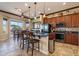 Modern kitchen featuring stainless steel appliances, granite countertops, and a breakfast bar with seating at 17844 E Pacana Ct, Gold Canyon, AZ 85118