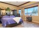 Bright main bedroom has tile floors, a ceiling fan and large windows providing ample natural light at 17844 E Pacana Ct, Gold Canyon, AZ 85118