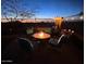 Cozy outdoor patio with a fire pit and comfortable seating, perfect for evening gatherings at 17844 E Pacana Ct, Gold Canyon, AZ 85118