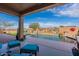 Inviting backyard pool area with a calming waterfall feature and an extended patio at 17844 E Pacana Ct, Gold Canyon, AZ 85118