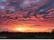 Scenic sunset view, vivid colors painting the sky with hues of pink, orange, and blue at 17844 E Pacana Ct, Gold Canyon, AZ 85118