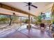 Large covered patio with ceiling fans and outdoor seating area at 1801 E Aire Libre Ave, Phoenix, AZ 85022