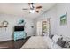 Main bedroom features a ceiling fan and sliding door access at 1801 E Aire Libre Ave, Phoenix, AZ 85022