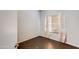 Simple bedroom with wood floors and window coverings at 1801 E Aire Libre Ave, Phoenix, AZ 85022