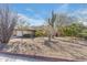 Single-story home with desert landscaping and a two-car garage at 1801 E Aire Libre Ave, Phoenix, AZ 85022