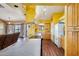 A full view of the kitchen showcasing the breakfast bar and seamless transition into the living room at 1801 E Aire Libre Ave, Phoenix, AZ 85022