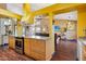 The kitchen and living room blend seamlessly, creating a communal space perfect for both cooking and entertaining at 1801 E Aire Libre Ave, Phoenix, AZ 85022