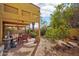 Outdoor patio with a ceiling fan and dining set is perfect for entertaining at 1801 E Aire Libre Ave, Phoenix, AZ 85022