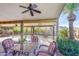 Covered patio features seating area and ceiling fan at 1801 E Aire Libre Ave, Phoenix, AZ 85022