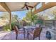 Relaxing patio area with wicker furniture and a brick floor at 1801 E Aire Libre Ave, Phoenix, AZ 85022