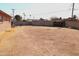 Large backyard with block wall and distant neighborhood view at 1914 N Lebaron --, Mesa, AZ 85201