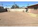 Large, flat backyard with block wall and some sparse vegetation at 1914 N Lebaron --, Mesa, AZ 85201