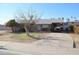 Ranch style home with carport and mature tree in front yard at 1914 N Lebaron --, Mesa, AZ 85201