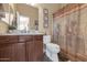 Clean bathroom with wood cabinets and updated fixtures at 19550 N Grayhawk Dr # 1107, Scottsdale, AZ 85255