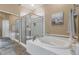 Spa-like bathroom with soaking tub and walk-in shower at 19550 N Grayhawk Dr # 1107, Scottsdale, AZ 85255