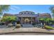 Elegant community clubhouse with fountain and landscaping at 19550 N Grayhawk Dr # 1107, Scottsdale, AZ 85255