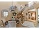 Elegant dining area with a spiral staircase and chandelier at 19550 N Grayhawk Dr # 1107, Scottsdale, AZ 85255