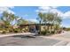 Gated community entrance with landscaping at 19550 N Grayhawk Dr # 1107, Scottsdale, AZ 85255