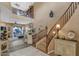 Grand entryway with a curved staircase and high ceilings at 19550 N Grayhawk Dr # 1107, Scottsdale, AZ 85255