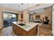 Island kitchen with granite countertops and stainless steel appliances at 19550 N Grayhawk Dr # 1107, Scottsdale, AZ 85255