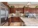 Updated kitchen with stainless steel appliances and granite counters at 19550 N Grayhawk Dr # 1107, Scottsdale, AZ 85255