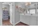 Bright bathroom with double sinks, vanity, and linen storage at 19646 E Reins Rd, Queen Creek, AZ 85142