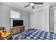 Bedroom with ceiling fan, large closet, and window at 19646 E Reins Rd, Queen Creek, AZ 85142