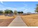 Walking path to a community park with playground and shaded seating at 19646 E Reins Rd, Queen Creek, AZ 85142