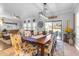 Bright dining room with large windows and a wooden table at 19646 E Reins Rd, Queen Creek, AZ 85142