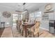 Farmhouse-style dining room with wooden table and window at 19646 E Reins Rd, Queen Creek, AZ 85142