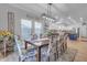 Open dining area with kitchen view and farmhouse decor at 19646 E Reins Rd, Queen Creek, AZ 85142