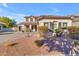 Two-story house with a three-car garage and landscaping at 19646 E Reins Rd, Queen Creek, AZ 85142