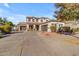 Two-story house with a three-car garage and landscaping at 19646 E Reins Rd, Queen Creek, AZ 85142