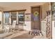 Front porch with rocking chairs and sunflowers at 19646 E Reins Rd, Queen Creek, AZ 85142