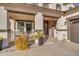 Front porch with rocking chairs and sunflowers at 19646 E Reins Rd, Queen Creek, AZ 85142