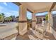 Covered porch with rocking chairs, providing a relaxing outdoor space at 19646 E Reins Rd, Queen Creek, AZ 85142