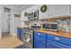 Modern kitchen with stainless steel appliances and wood countertops at 19646 E Reins Rd, Queen Creek, AZ 85142