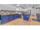 Kitchen with butcher block countertops, blue cabinets, and stainless steel appliances at 19646 E Reins Rd, Queen Creek, AZ 85142