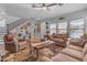 Cozy living room featuring a comfortable seating area and hardwood floors at 19646 E Reins Rd, Queen Creek, AZ 85142